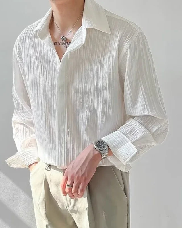 Chemise Raoul blanche pour homme avec col rabattu et boutonnage simple.