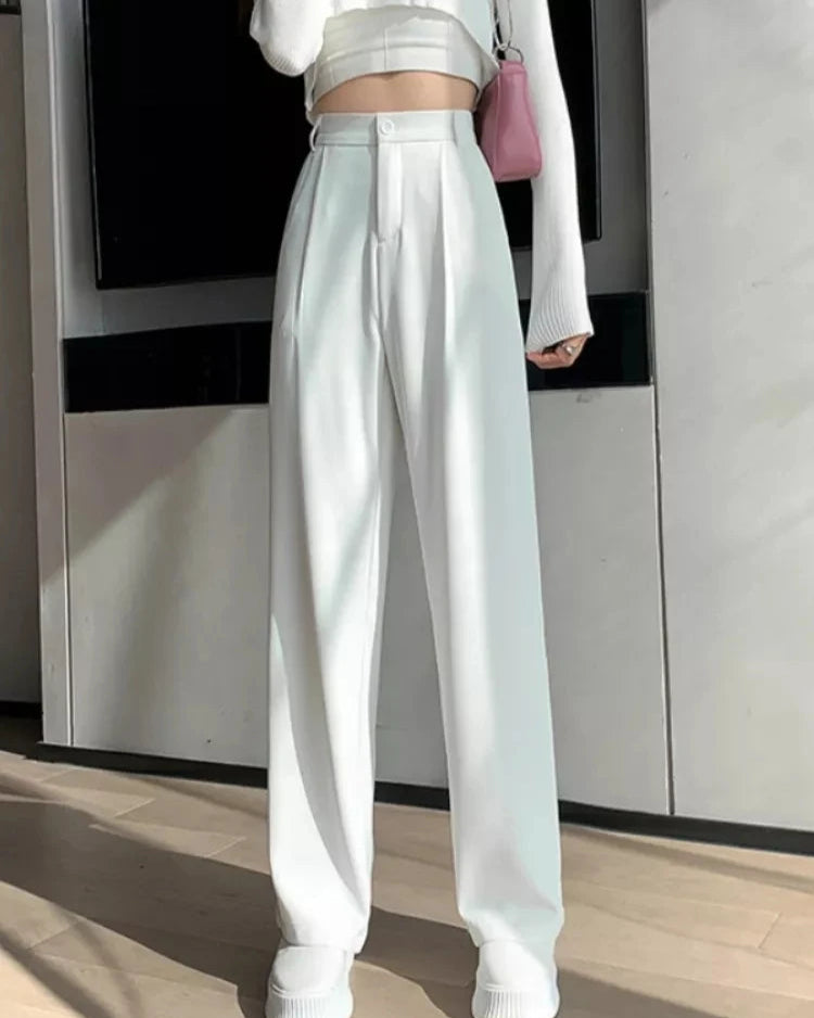 Pantalon Zélie blanc femme, coupe large, en mousseline de soie, avec braguette zippée.